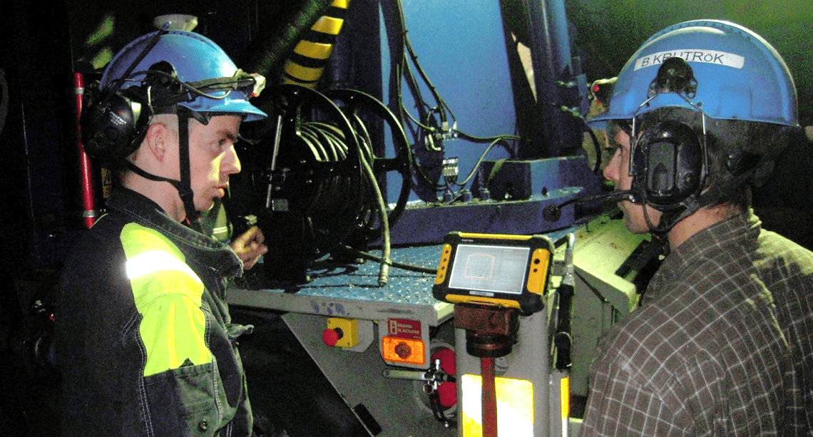 LKAB, Kiruna, Sweden. The shotcrete operator discusses spraying performance with the production planner. Scans are used to calculate the applied shotcrete thickness directly after spraying.